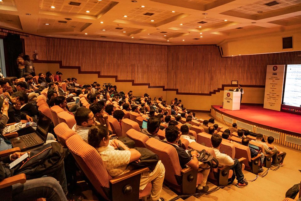 Corporate event in India with professionals gathered for a business meeting and presentations